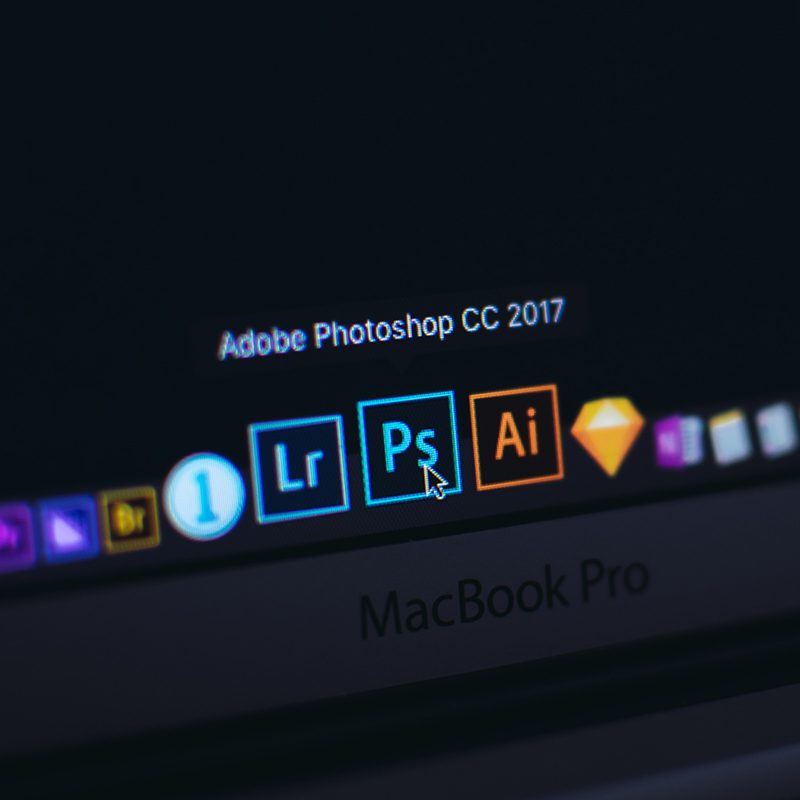 computer with adobe software icons
