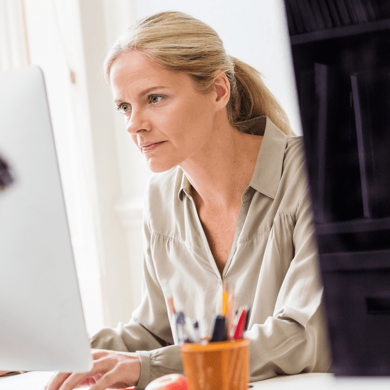 female designer typing at desktop