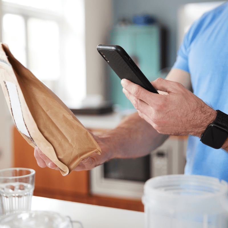 man scanning qr code on bag