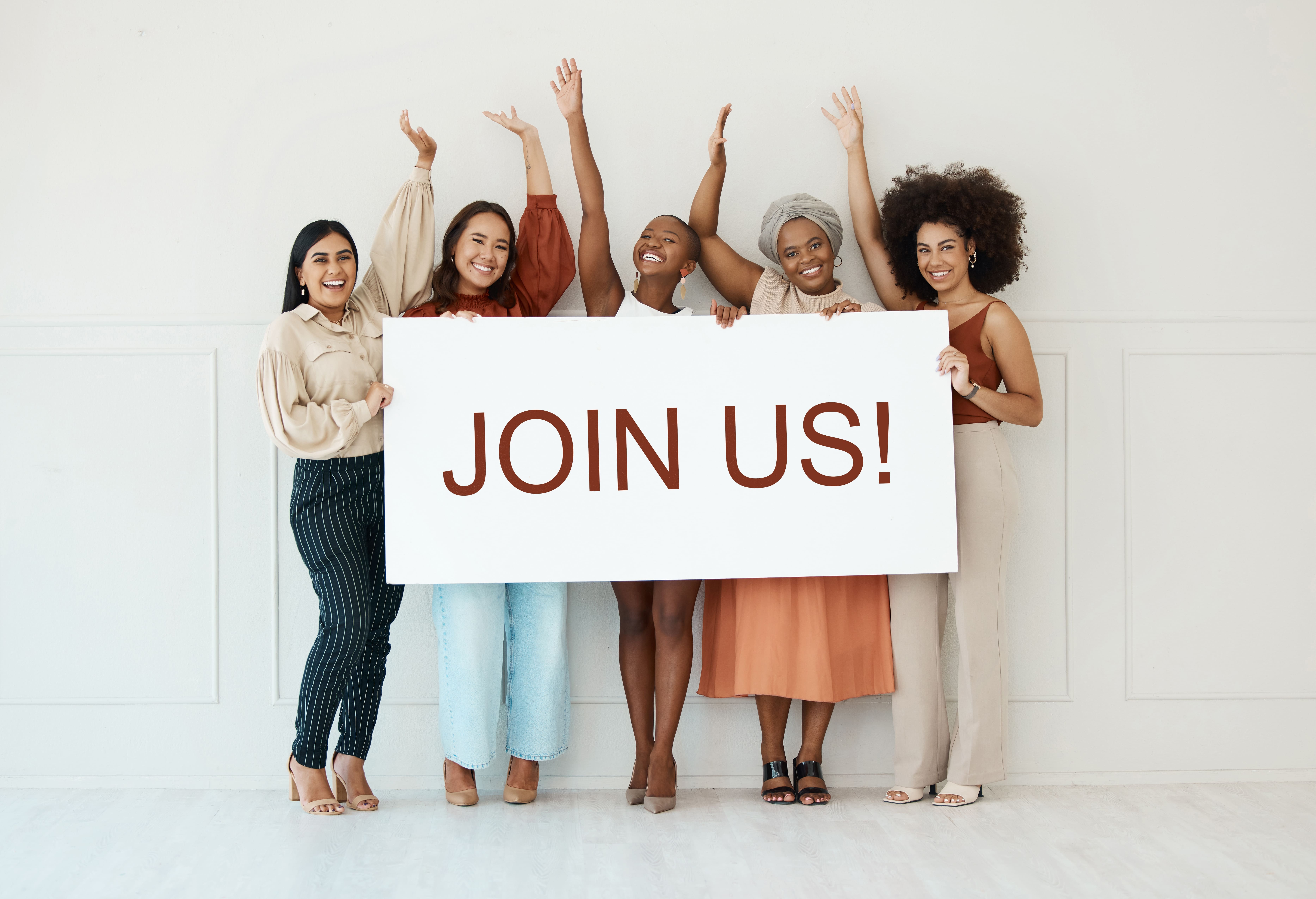 Group of women holding JOIN US sign