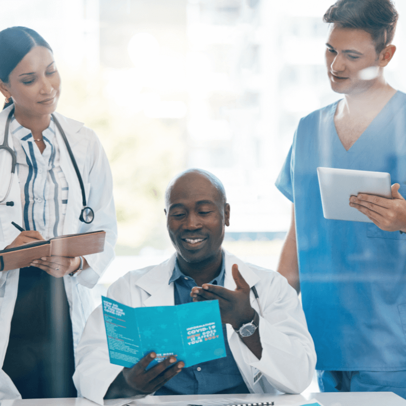 diversity-doctors-team-and-healthcare-planning health care team looking at brochure