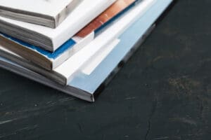Close up stacking magazine place on table background Close up stacking magazine place on table background