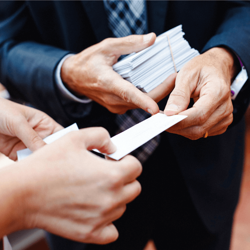 businessman-giving-a-blank-business-card-to-client businessman handing out his business card