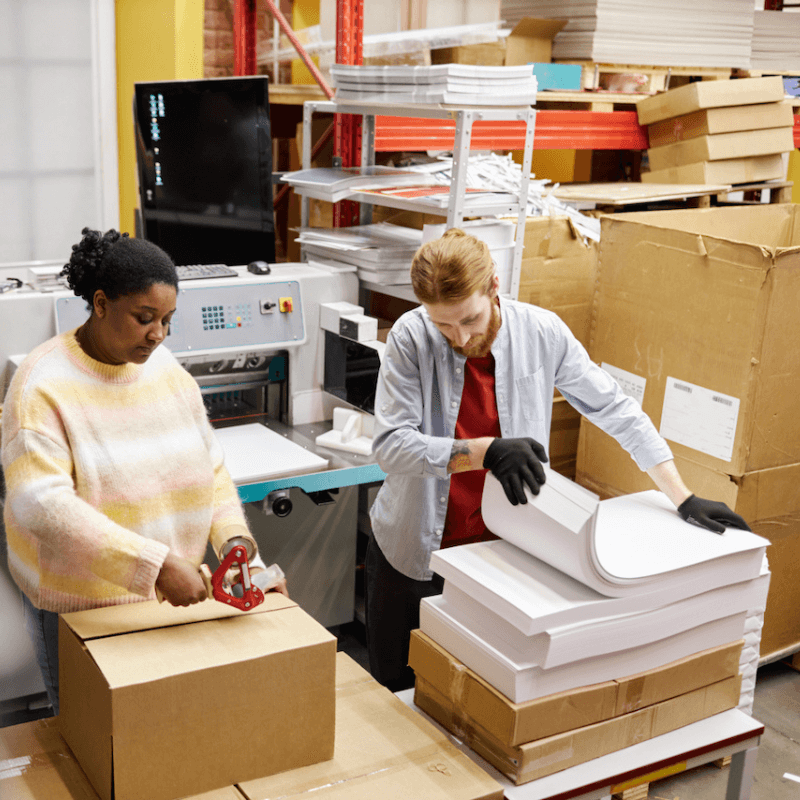 workers-checking-paper-quality-at-printing-factory Workers checking on paper quality in print shop