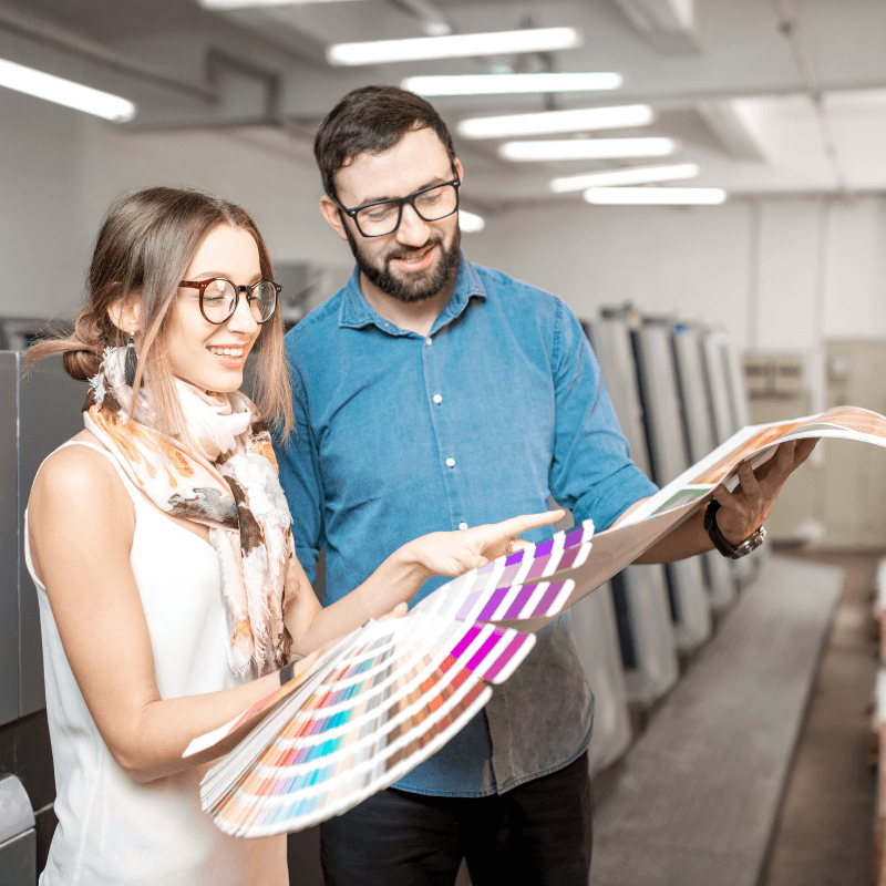printers looking over color pallets and options in the print shop