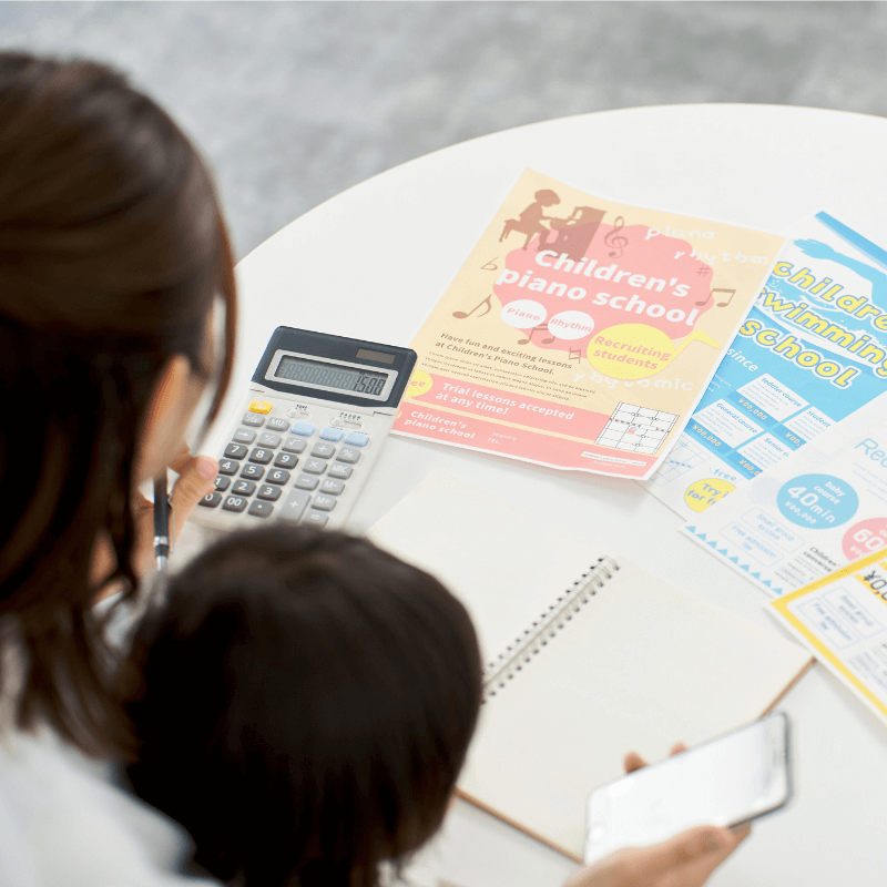 a-woman-choosing-lessons-for-her-child a woman choosing lesson cards for her child, all in matte finish