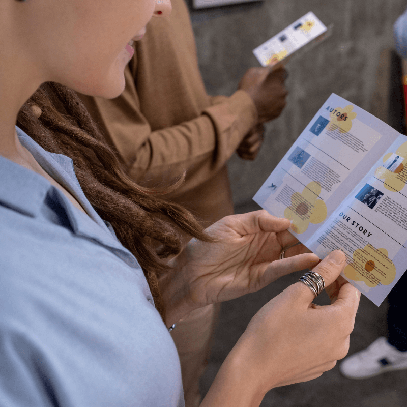 woman-reading-a-guide-in-art-gallery woman reading a guide in matte finish print