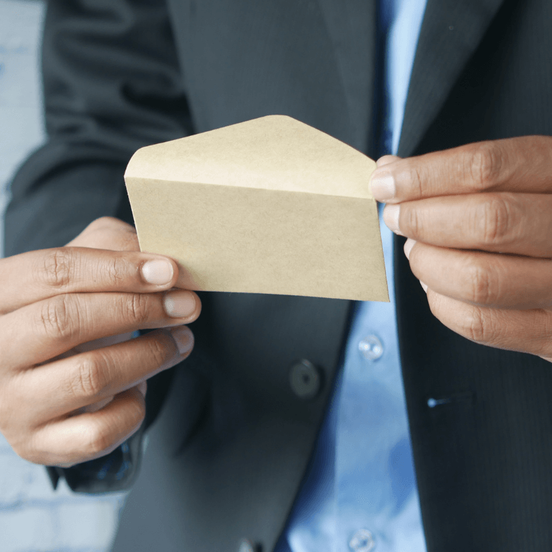close-up of business man opening an envelope.