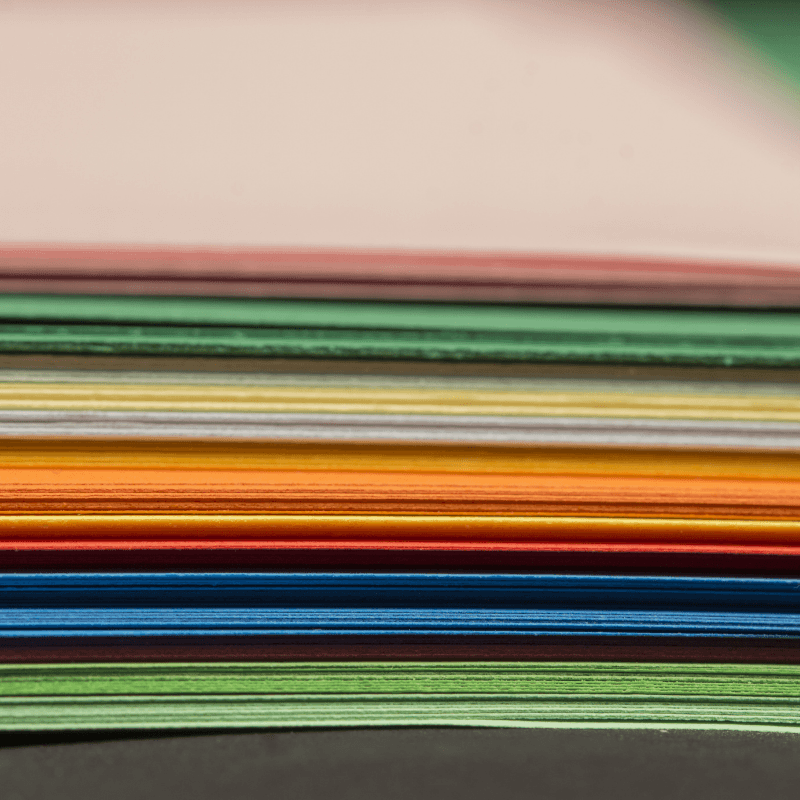 Stack of multi-colored craft paper close up Stack of multi-colored craft paper