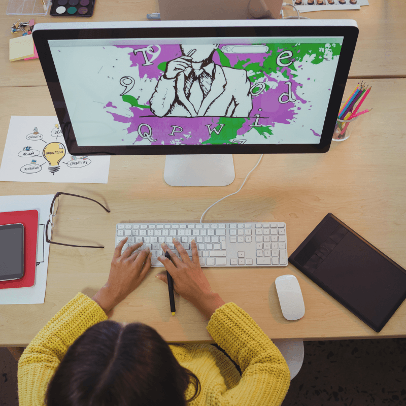 Graphic designer working on a project at her desk